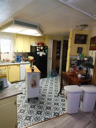 a kitchen with a sink stove top oven and microwave