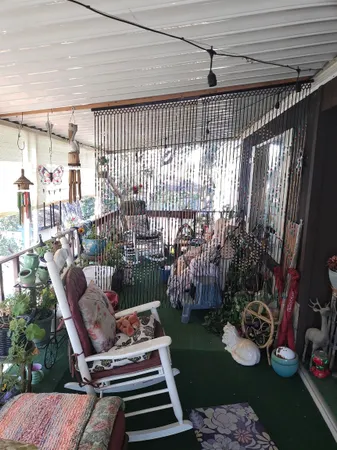 a view of a porch with furniture