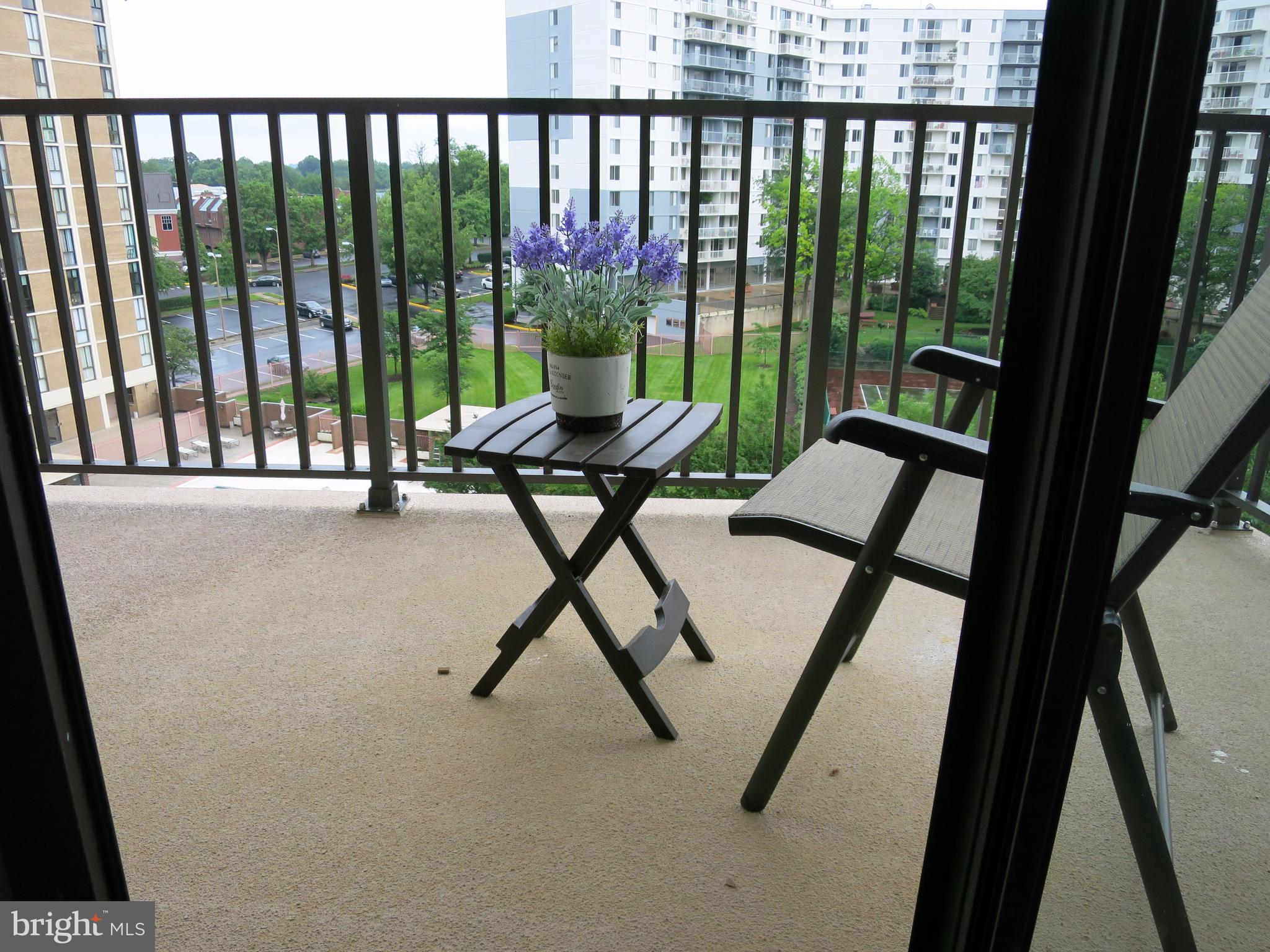 6800 Fleetwood Road, Unit 716 McLean, VA 22101 - Photo 4 of 17 a view of a porch with furniture and garden