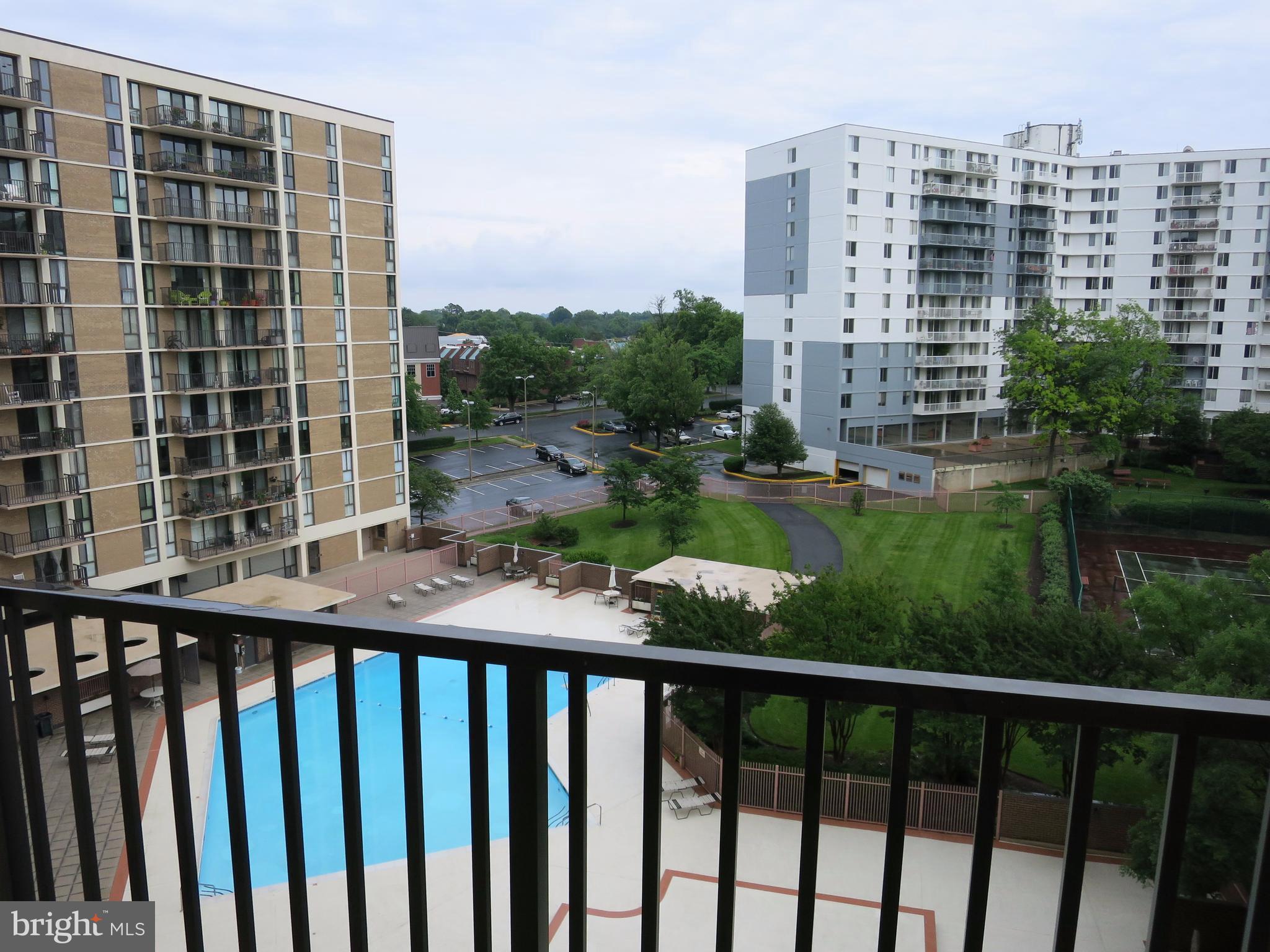 6800 Fleetwood Road, Unit 716 McLean, VA 22101 - Photo 5 of 17 a view of balcony with a yard and wooden fence