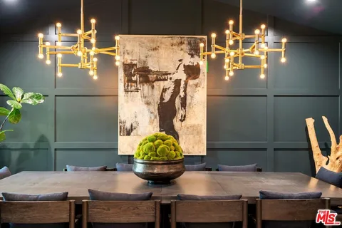 a dining room with furniture and chandelier