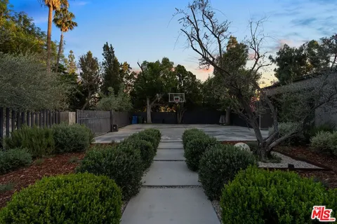 a view of house with yard and green space