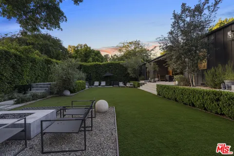 a view of a garden with patio