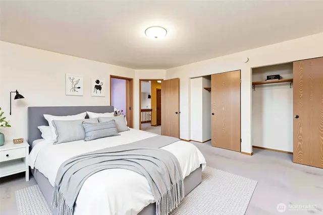 a bedroom with a large bed and a closet