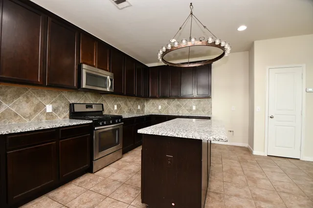 a kitchen with a sink and a cabinets