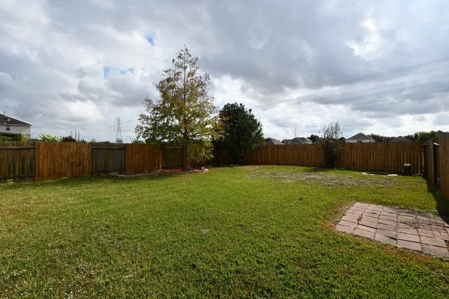 a view of house with yard