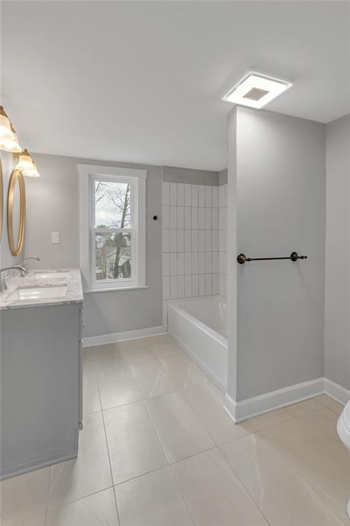 517 Adams Street Rochester, PA 15074 - Photo 15 of 21 a bathroom with a sink a toilet and shower