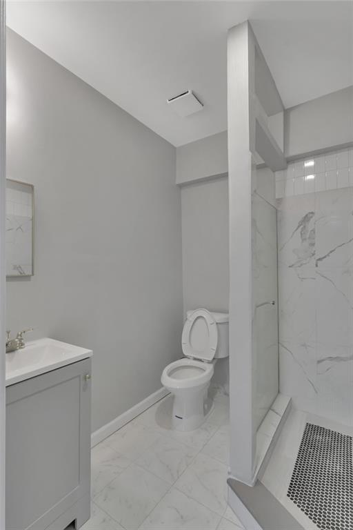 517 Adams Street Rochester, PA 15074 - Photo 21 of 21 a white toilet sitting next to a bathroom sink