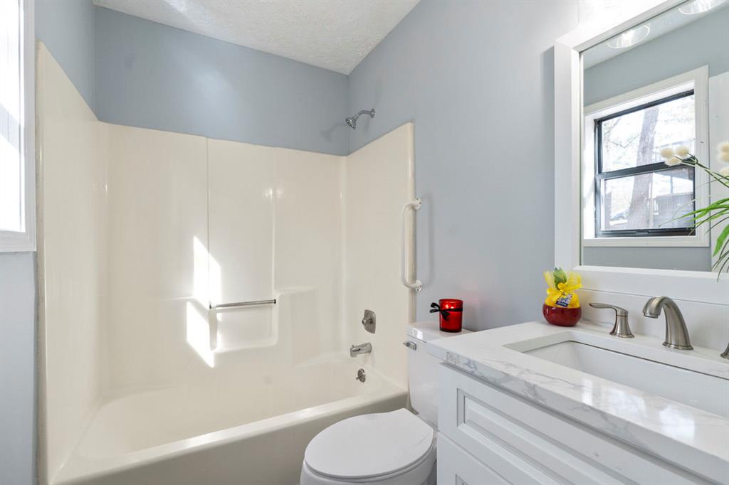 1213 Hanover Place Alpharetta, GA 30009 - Photo 18 of 25 a bathroom with a sink toilet and shower