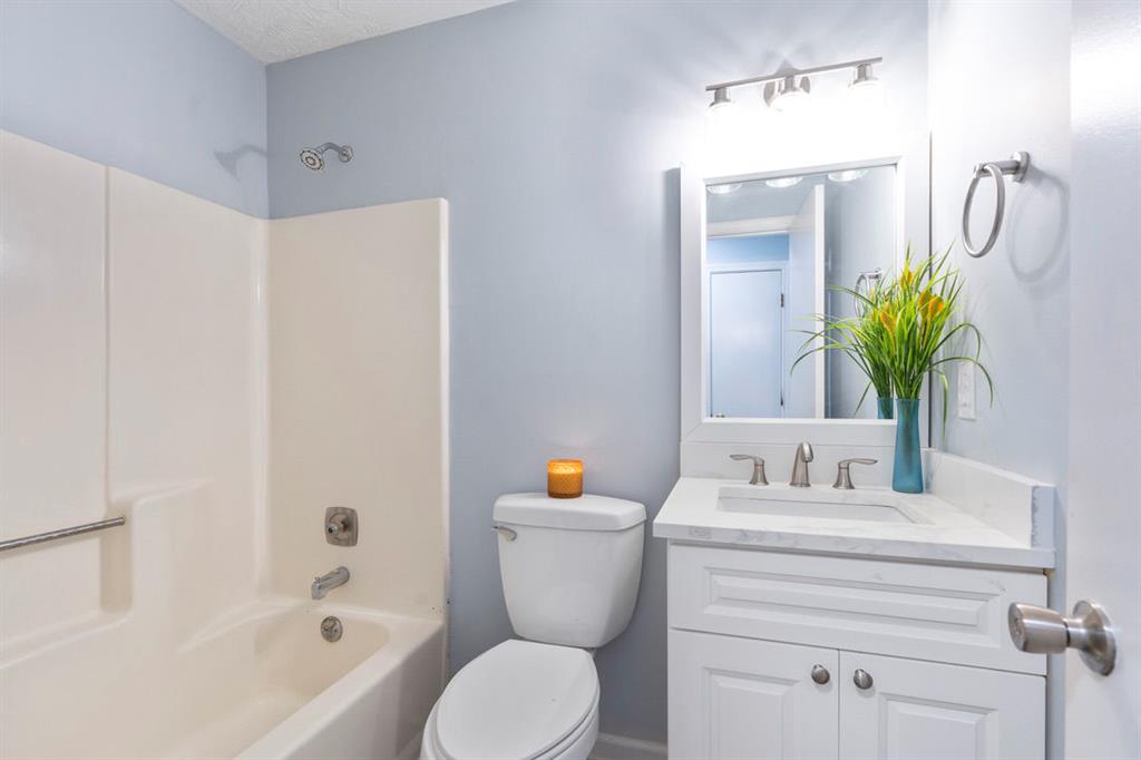 1213 Hanover Place Alpharetta, GA 30009 - Photo 21 of 25 a bathroom with a sink toilet and shower