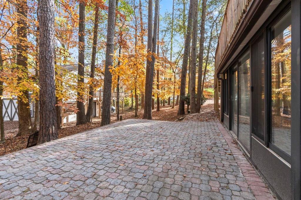 1213 Hanover Place Alpharetta, GA 30009 - Photo 22 of 25 a sidewalk with trees in front of it