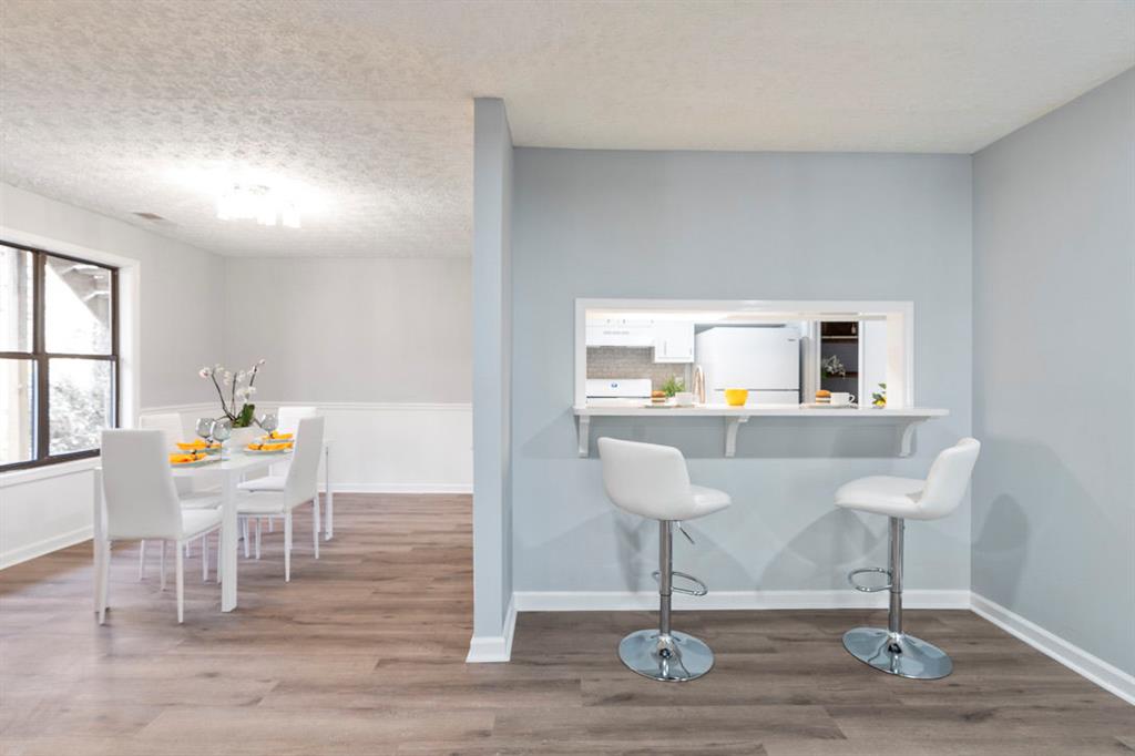 1213 Hanover Place Alpharetta, GA 30009 - Photo 6 of 25 a view of a dining room with furniture window and wooden floor