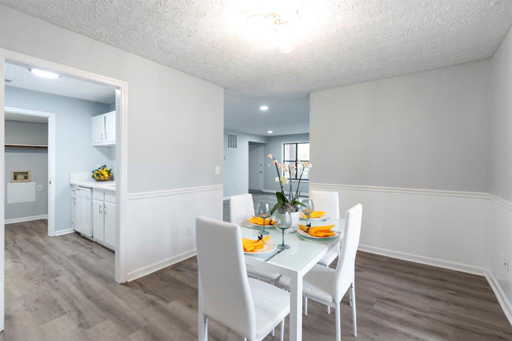 1213 Hanover Place Alpharetta, GA 30009 - Photo 10 of 25 a view of dining room and wooden floor