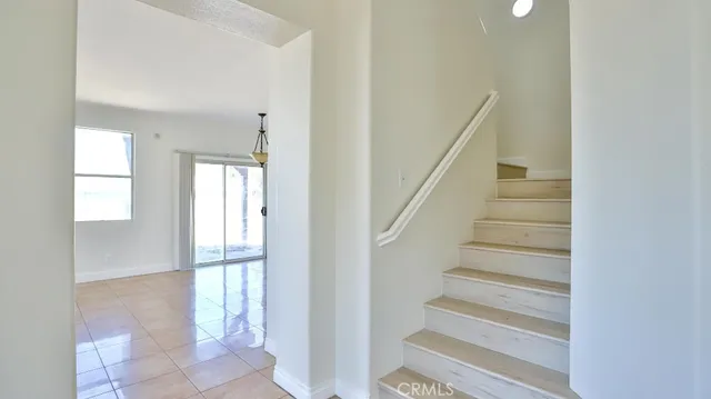 a view of entryway with bedroom and wooden floor