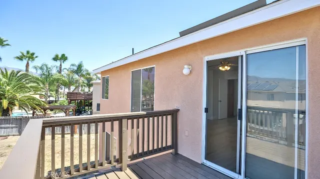a balcony view with a potted plant from a balcony