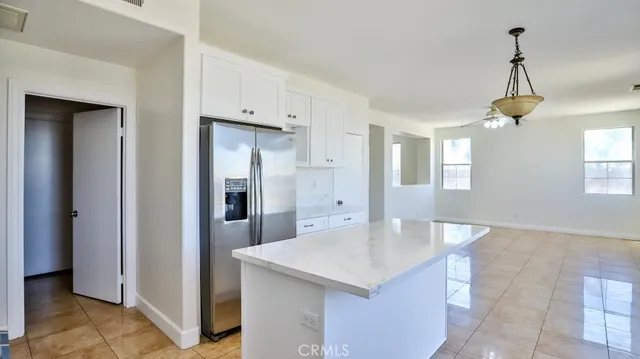 a kitchen with stainless steel appliances a sink and refrigerator