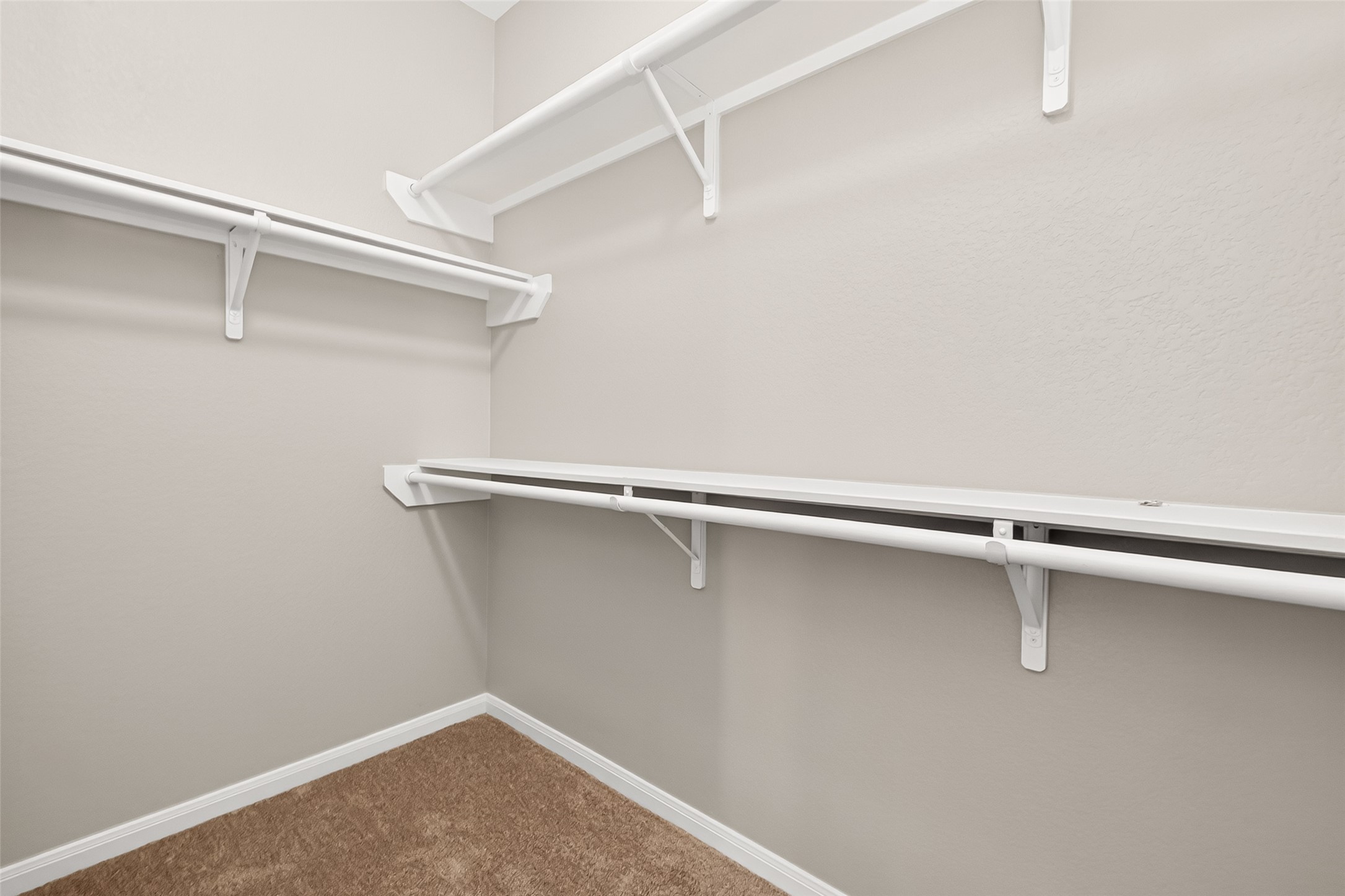 21327 Bella Flora Court Spring, TX 77379 - Photo 26 of 50 a view of a room with racks on the wall