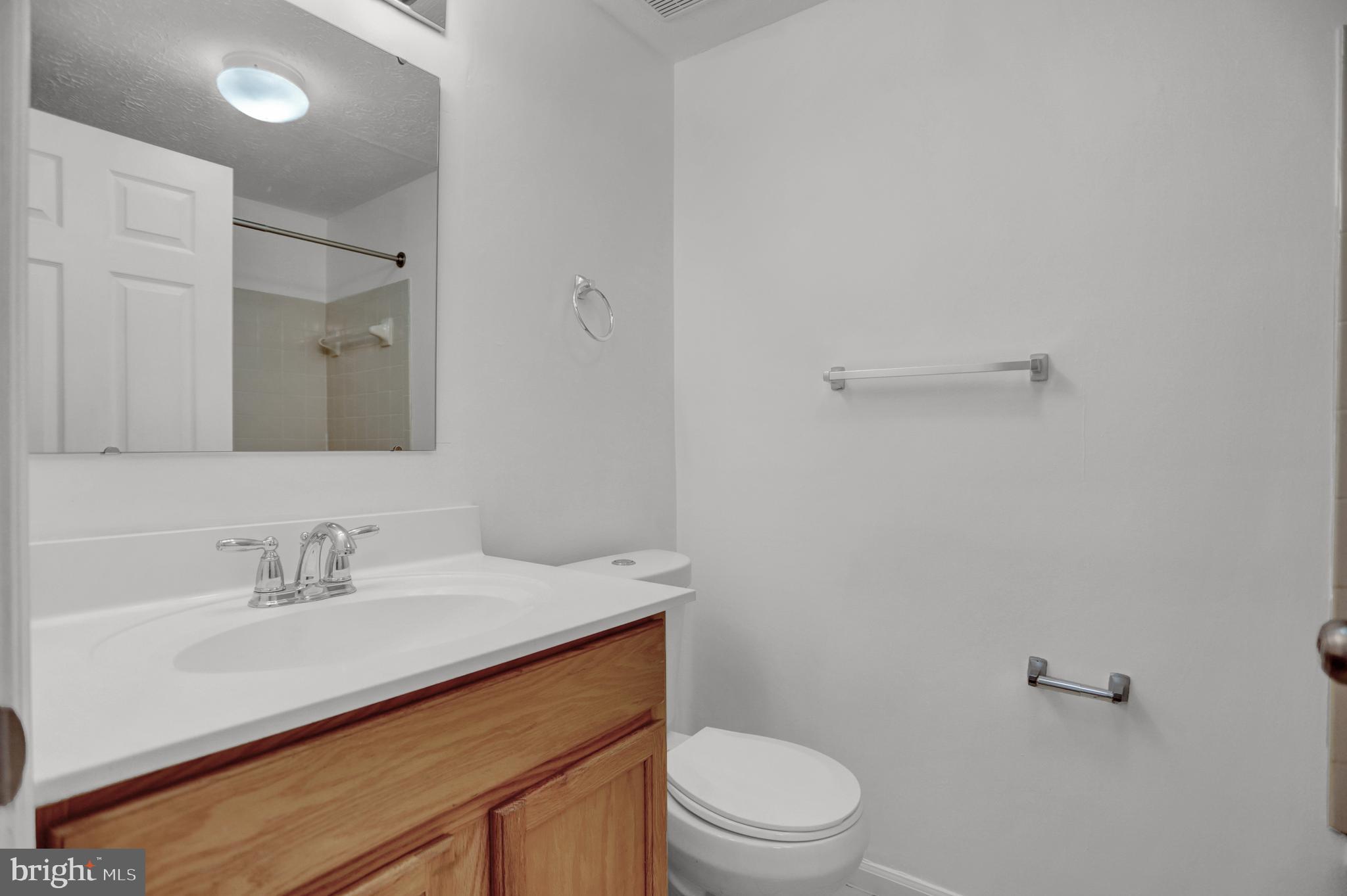 904 A Swallow Crest Court, Unit 904A Edgewood, MD 21040 - Photo 16 of 33 a bathroom with a sink a toilet and shower