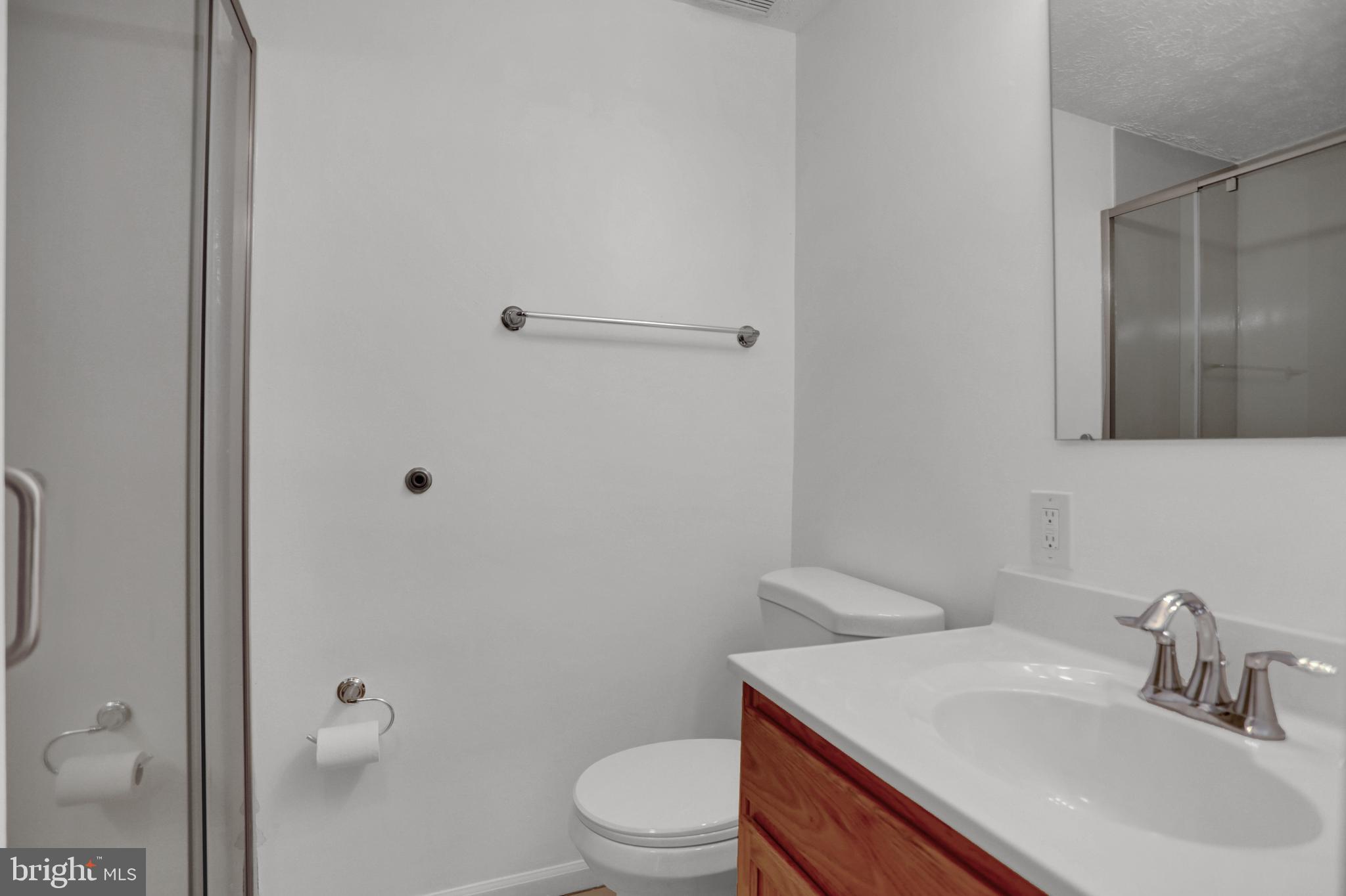 904 A Swallow Crest Court, Unit 904A Edgewood, MD 21040 - Photo 24 of 33 a bathroom with a sink a toilet and shower