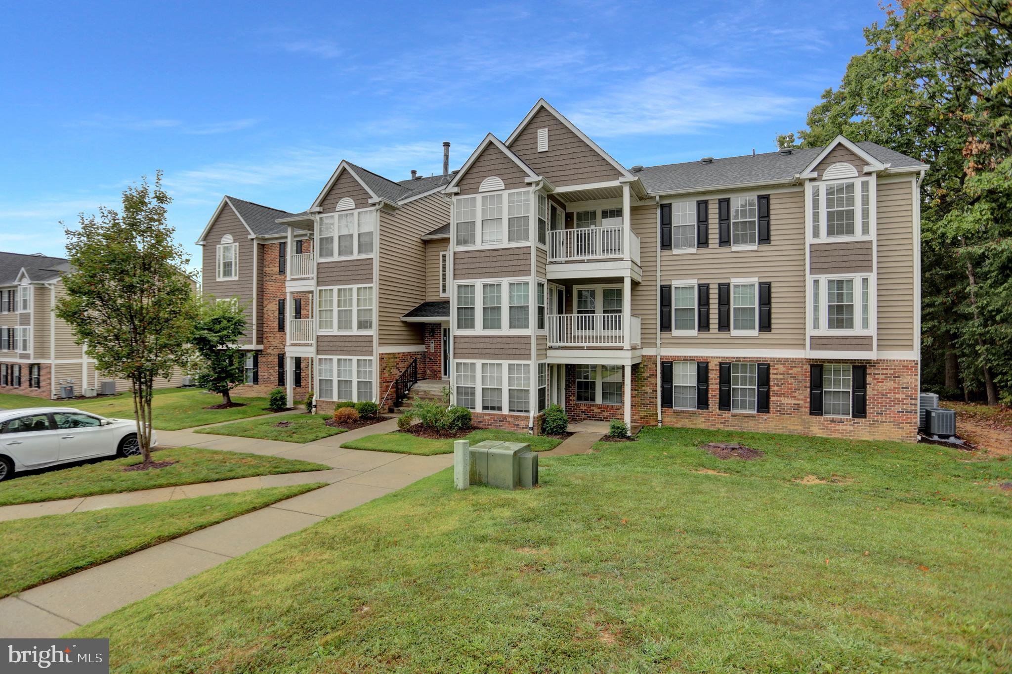 904 A Swallow Crest Court, Unit 904A Edgewood, MD 21040 - Photo 30 of 33 a front view of a building with a garden and trees