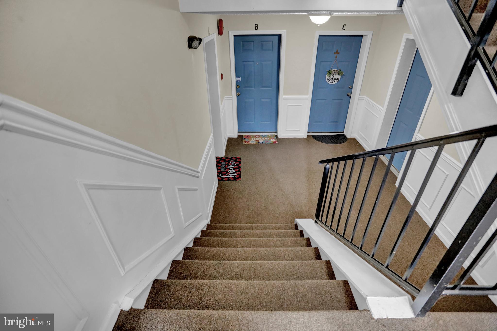 904 A Swallow Crest Court, Unit 904A Edgewood, MD 21040 - Photo 32 of 33 a view of staircase with lots of frames on wall and stairs