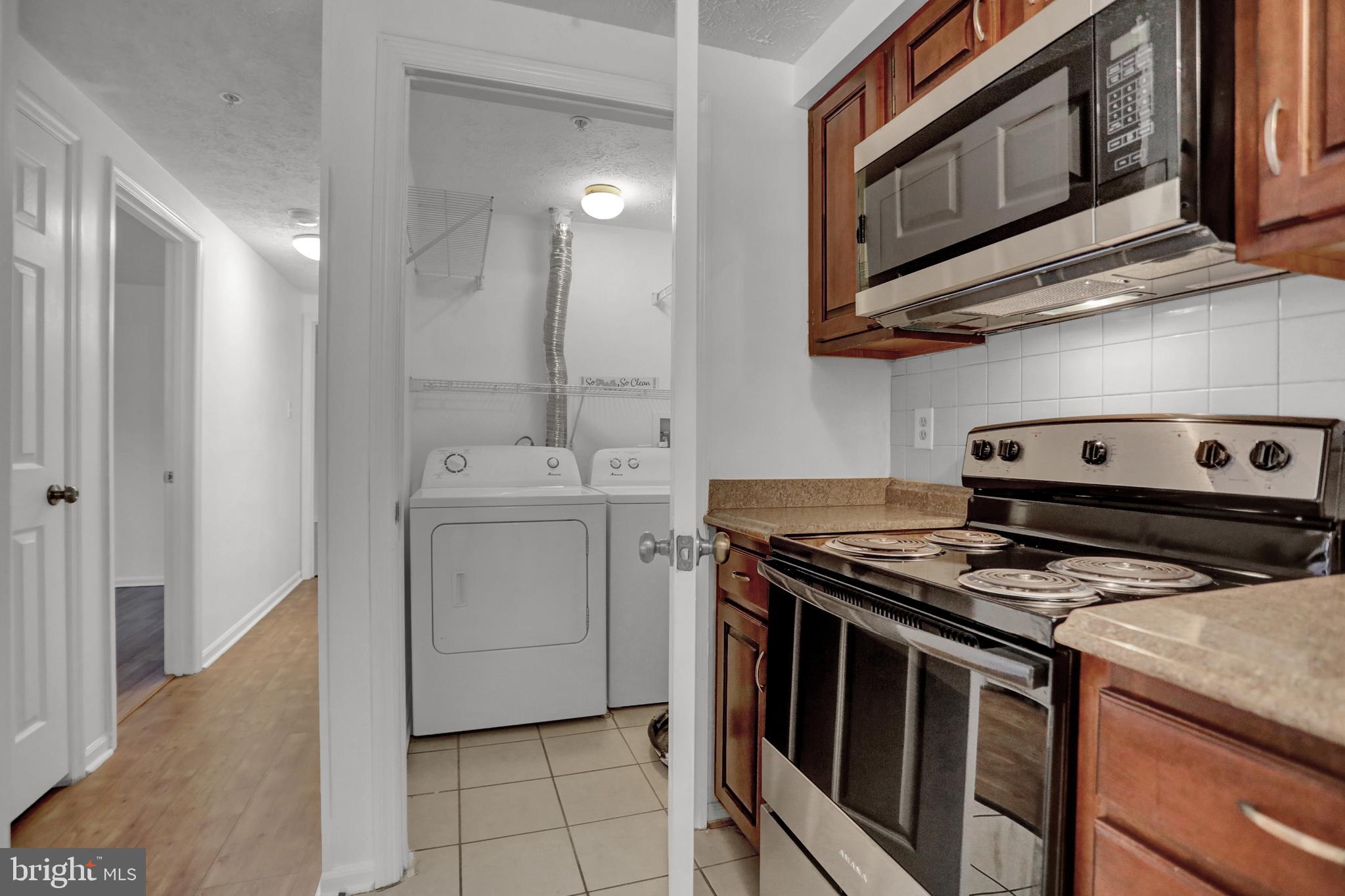904 A Swallow Crest Court, Unit 904A Edgewood, MD 21040 - Photo 8 of 33 a kitchen with stainless steel appliances granite countertop a stove and a microwave