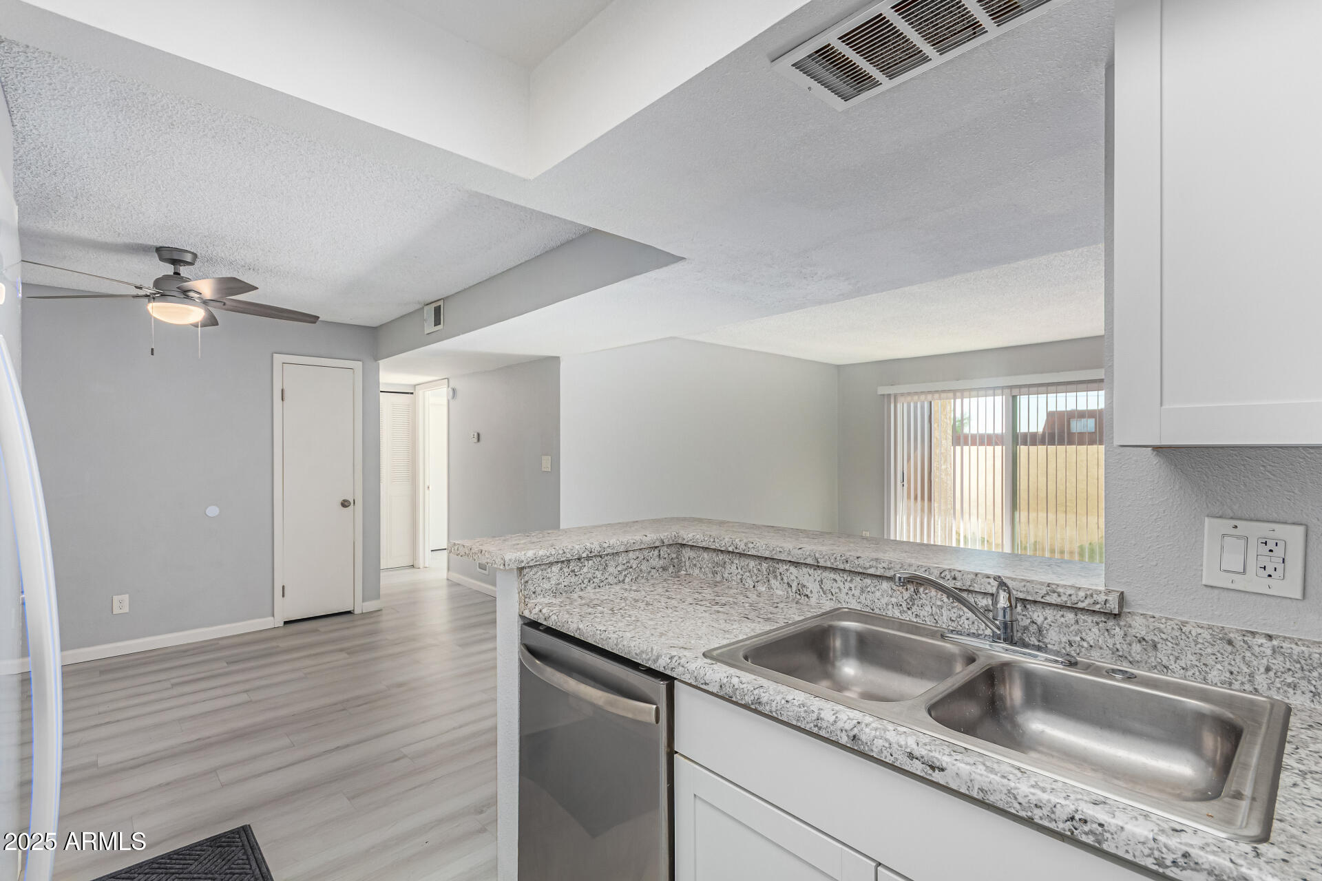 4730 West Northern Avenue, Unit 1087 Glendale, AZ 85301 - Photo 14 of 34 a kitchen with a sink and granite counter tops