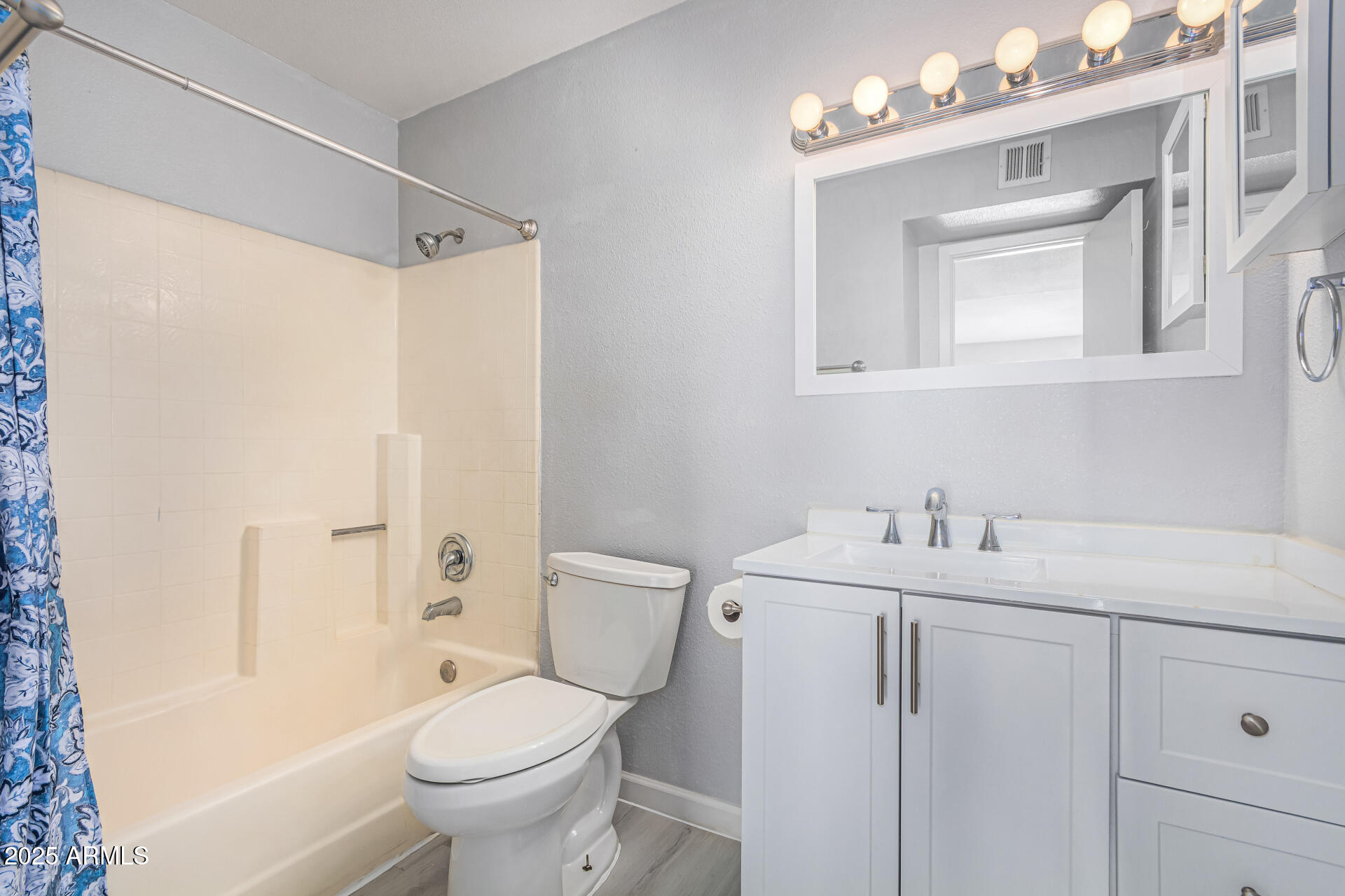 4730 West Northern Avenue, Unit 1087 Glendale, AZ 85301 - Photo 20 of 34 a bathroom with a sink vanity mirror and toilet