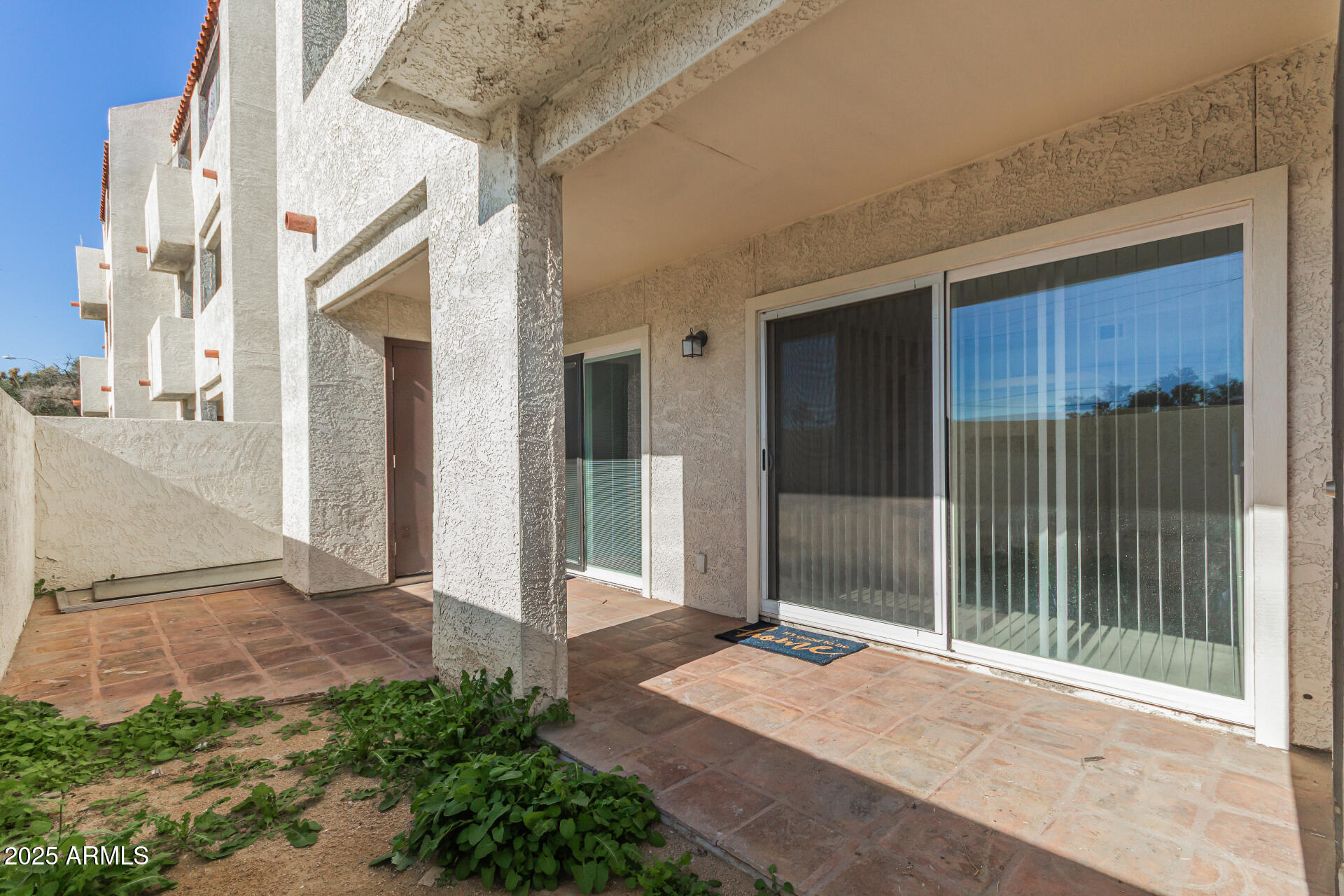 4730 West Northern Avenue, Unit 1087 Glendale, AZ 85301 - Photo 28 of 34 a house with a outdoor space