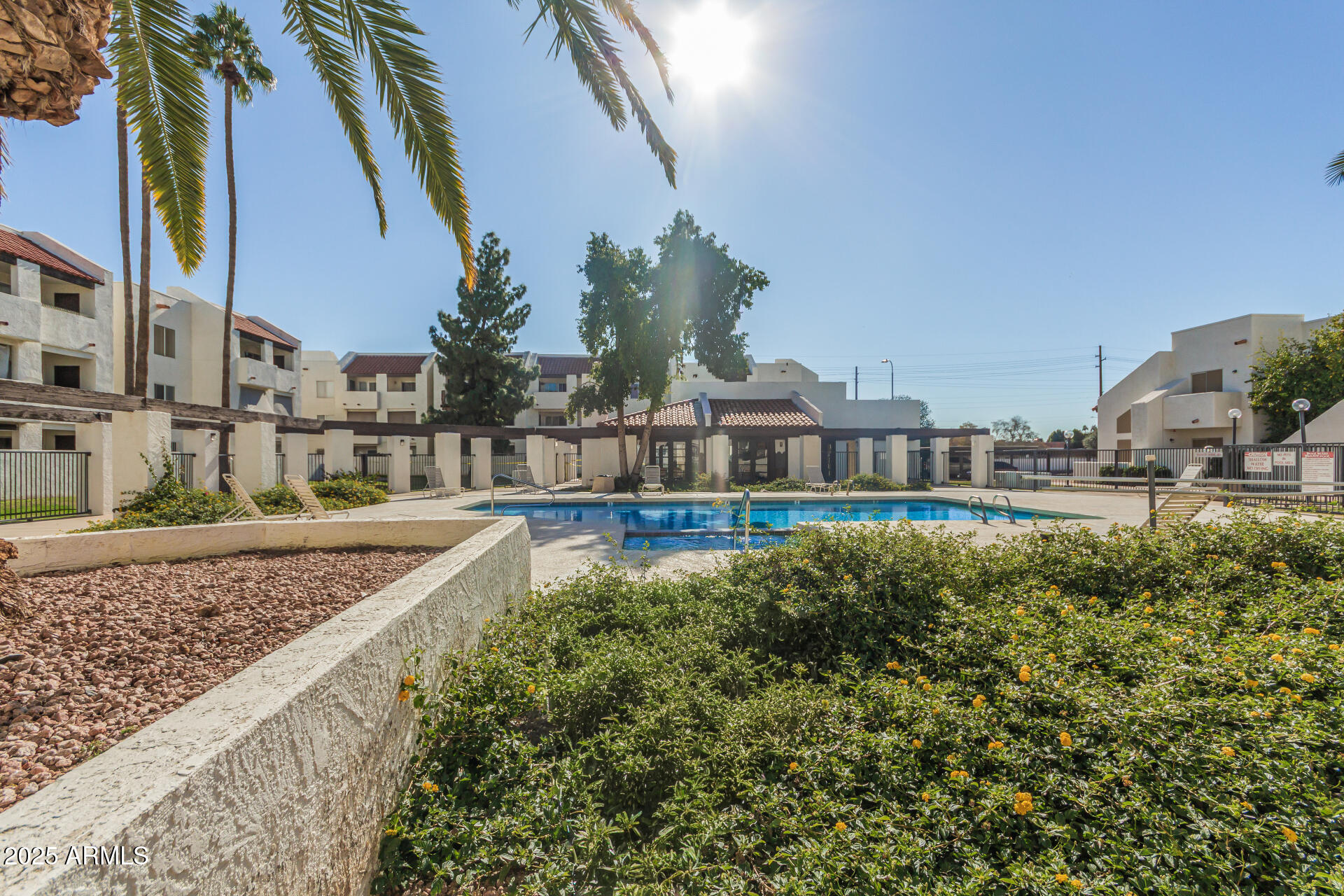 4730 West Northern Avenue, Unit 1087 Glendale, AZ 85301 - Photo 32 of 34 a view of a house with a swimming pool