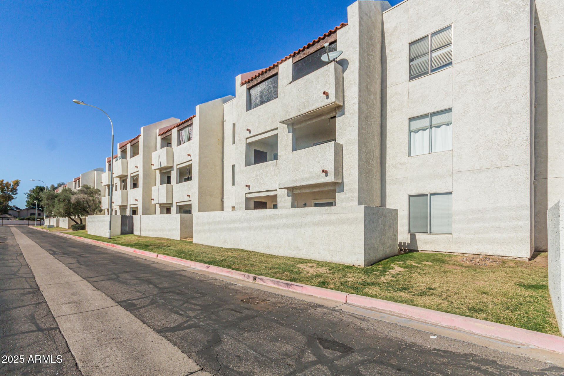 4730 West Northern Avenue, Unit 1087 Glendale, AZ 85301 - Photo 34 of 34 a view of a building with a street