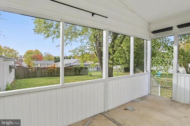 a view of a room that has a large window
