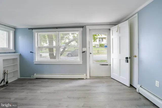 a view of an empty room with a window