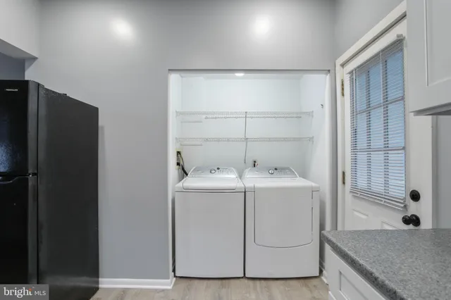 a utility room with dryer and washer