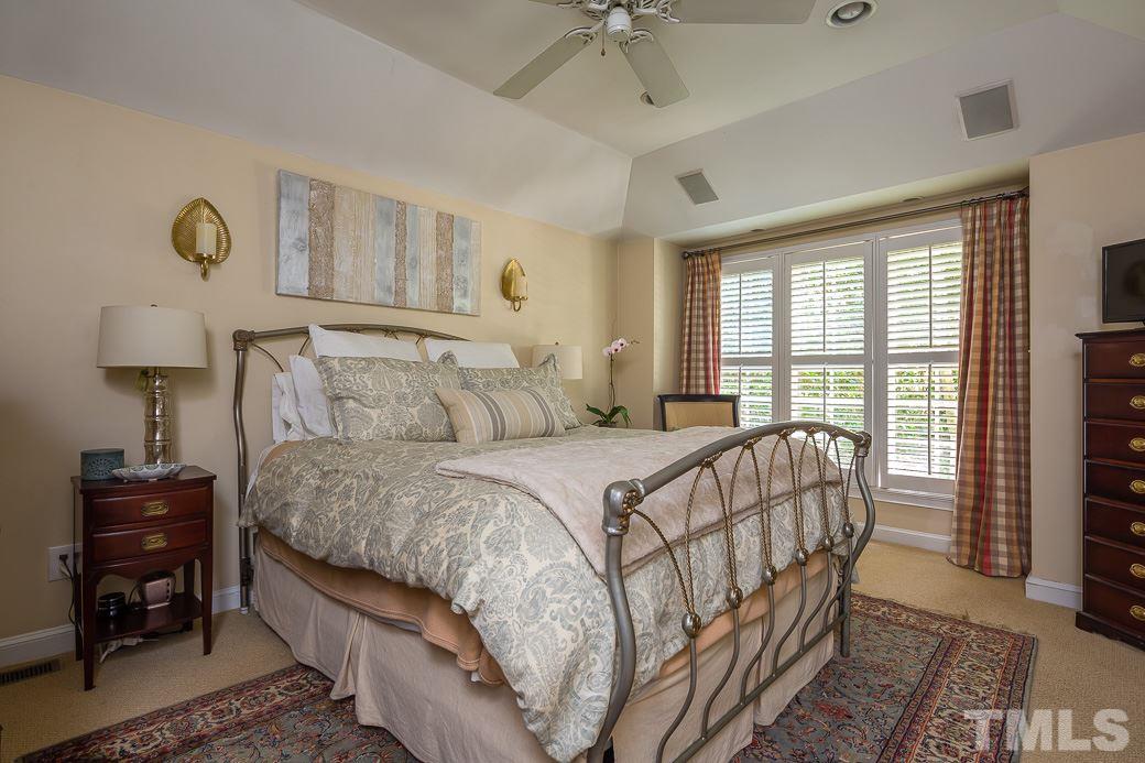 3104 Georgian Terrace Raleigh, NC 27607 - Photo 12 of 25 a bedroom with a bed and a table