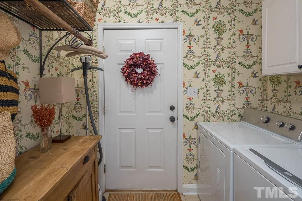 3104 Georgian Terrace Raleigh, NC 27607 - Photo 17 of 25 a bathroom with a sink and mirror