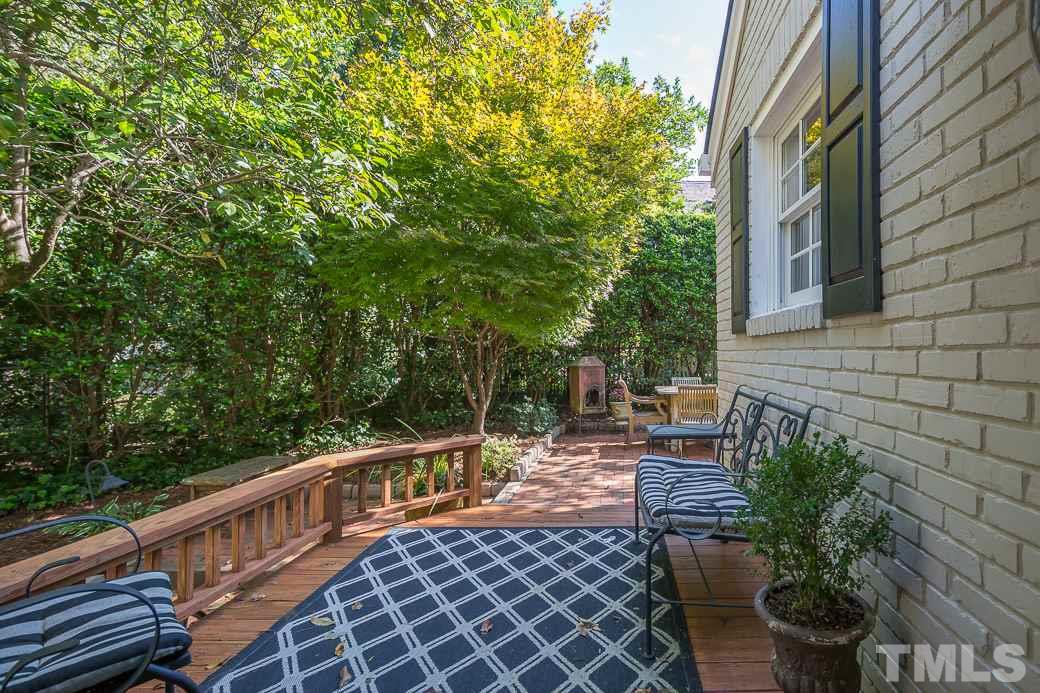3104 Georgian Terrace Raleigh, NC 27607 - Photo 20 of 25 a view of a chairs and table on the wooden deck