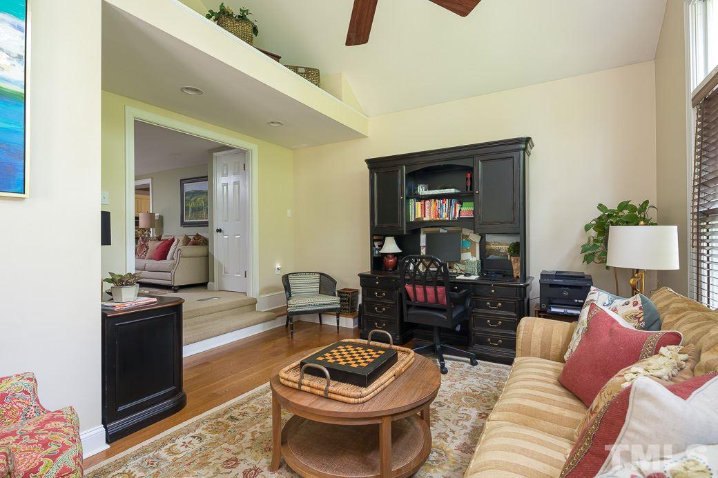 3104 Georgian Terrace Raleigh, NC 27607 - Photo 7 of 25 a living room with furniture and a wooden floor