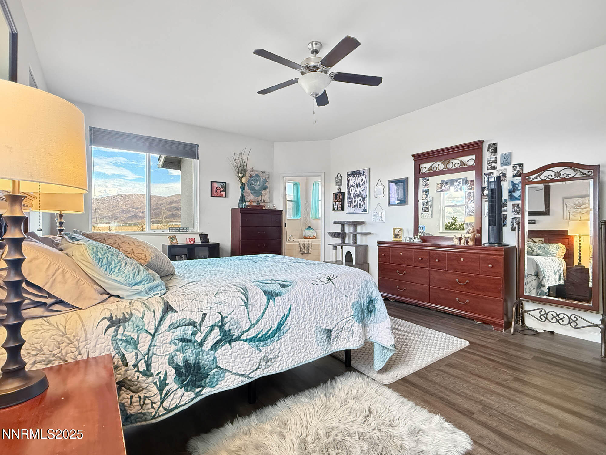 105 James Ranch Court Reno, NV 89510 - Photo 12 of 36 a spacious bedroom with a bed and wooden floor