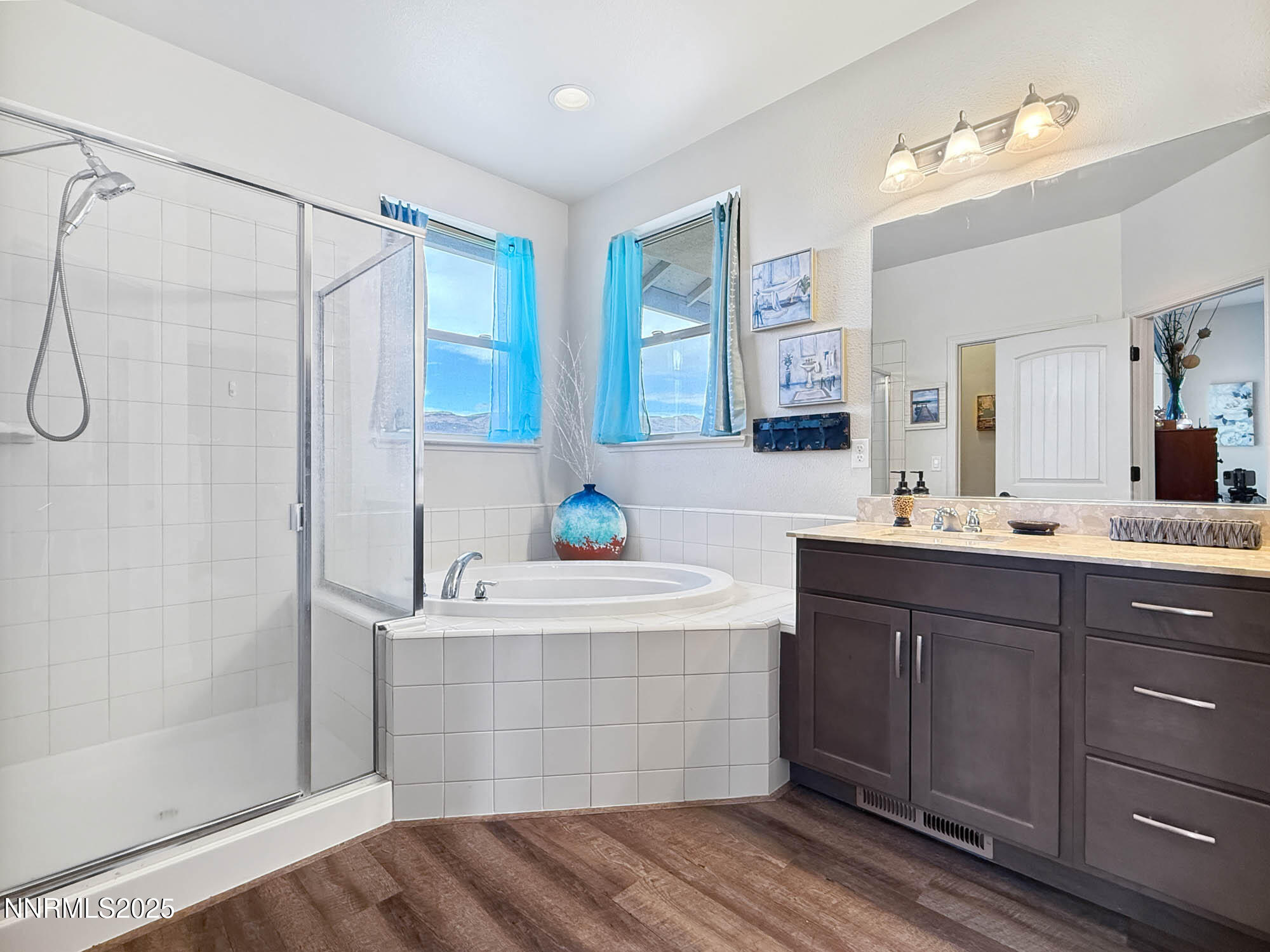 105 James Ranch Court Reno, NV 89510 - Photo 15 of 36 a bathroom with a double vanity sink mirror and shower