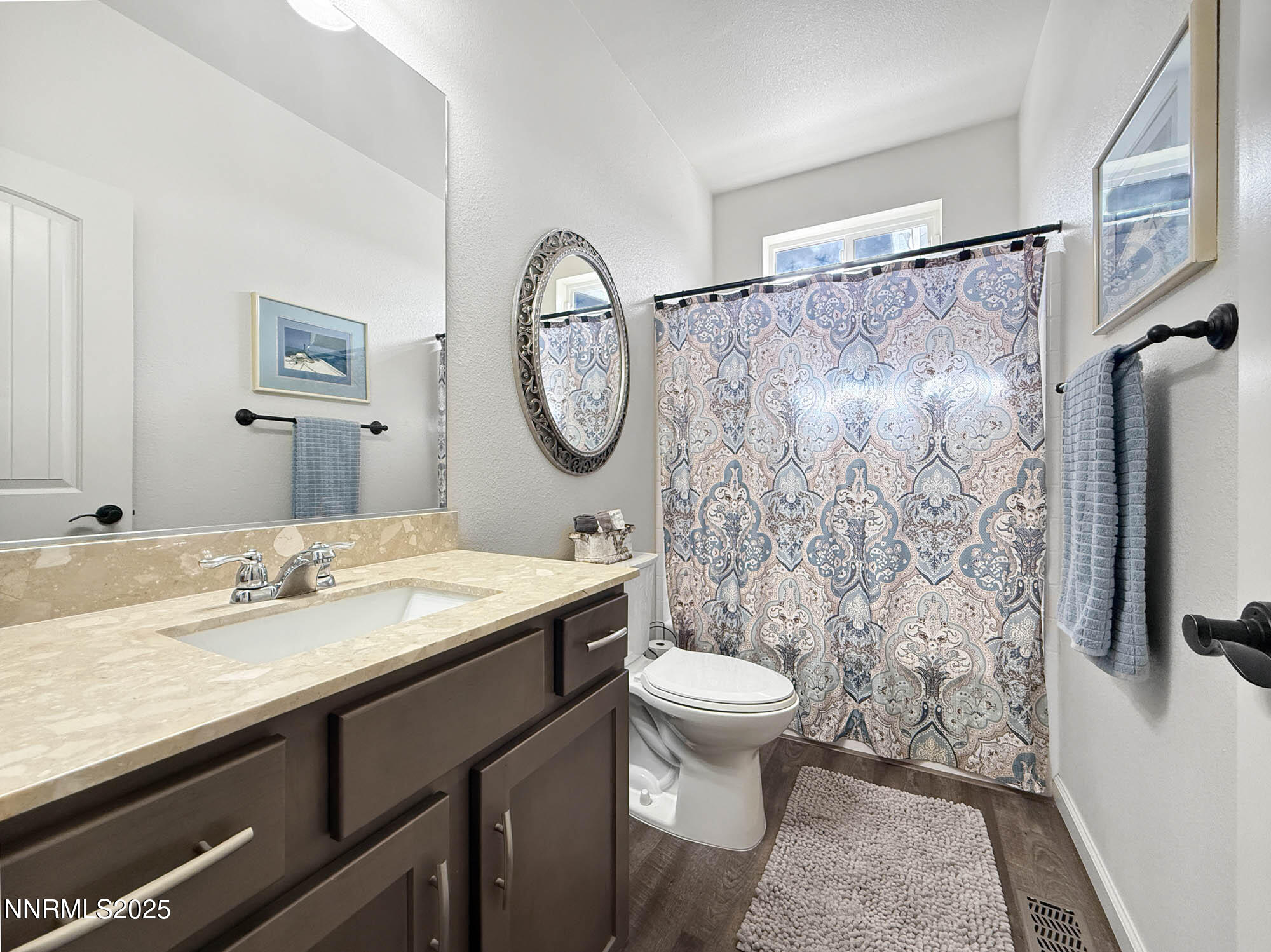 105 James Ranch Court Reno, NV 89510 - Photo 20 of 36 a bathroom with a sink and a mirror