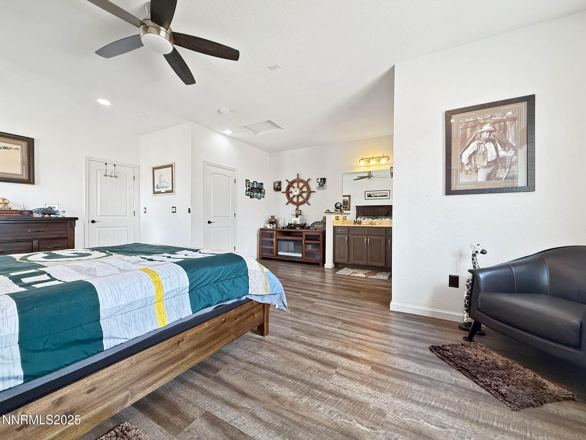 105 James Ranch Court Reno, NV 89510 - Photo 24 of 36 a spacious bedroom with a bed and furniture