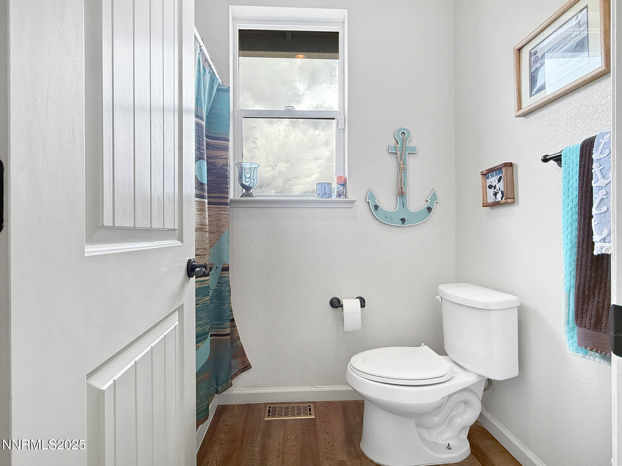105 James Ranch Court Reno, NV 89510 - Photo 25 of 36 a white toilet sitting next to a bathroom sink