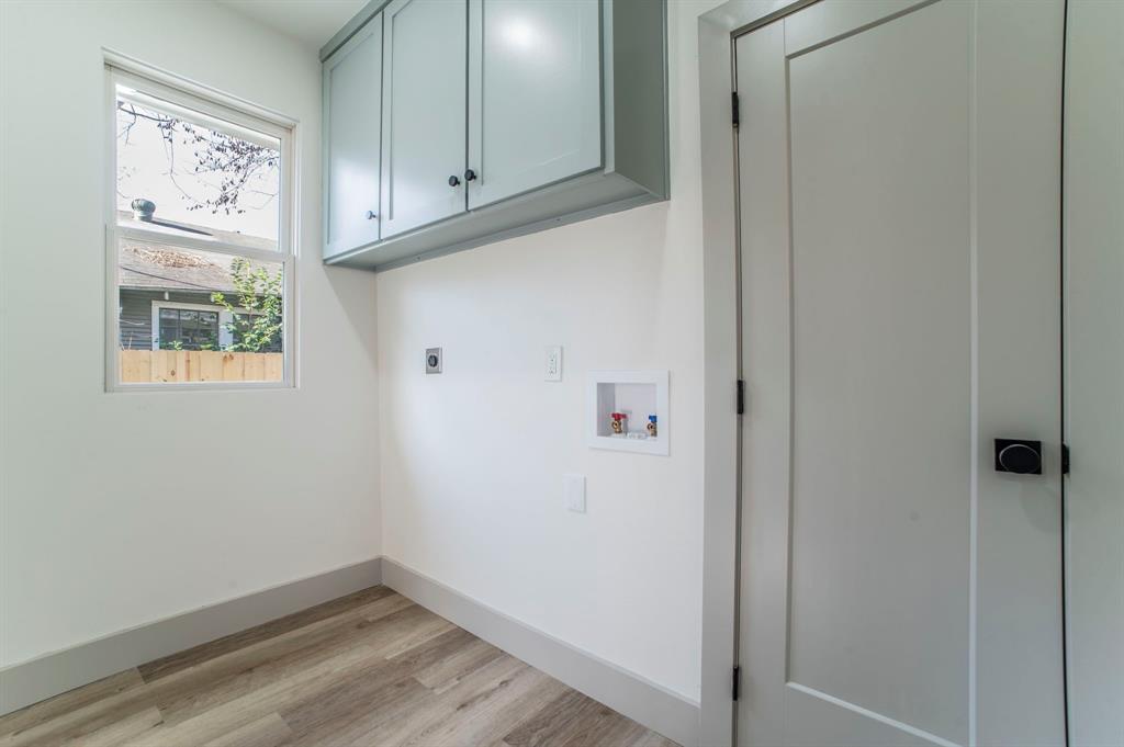 5914 Victor Street Dallas, TX 75214 - Photo 27 of 32 a view of cabinets and wooden floor