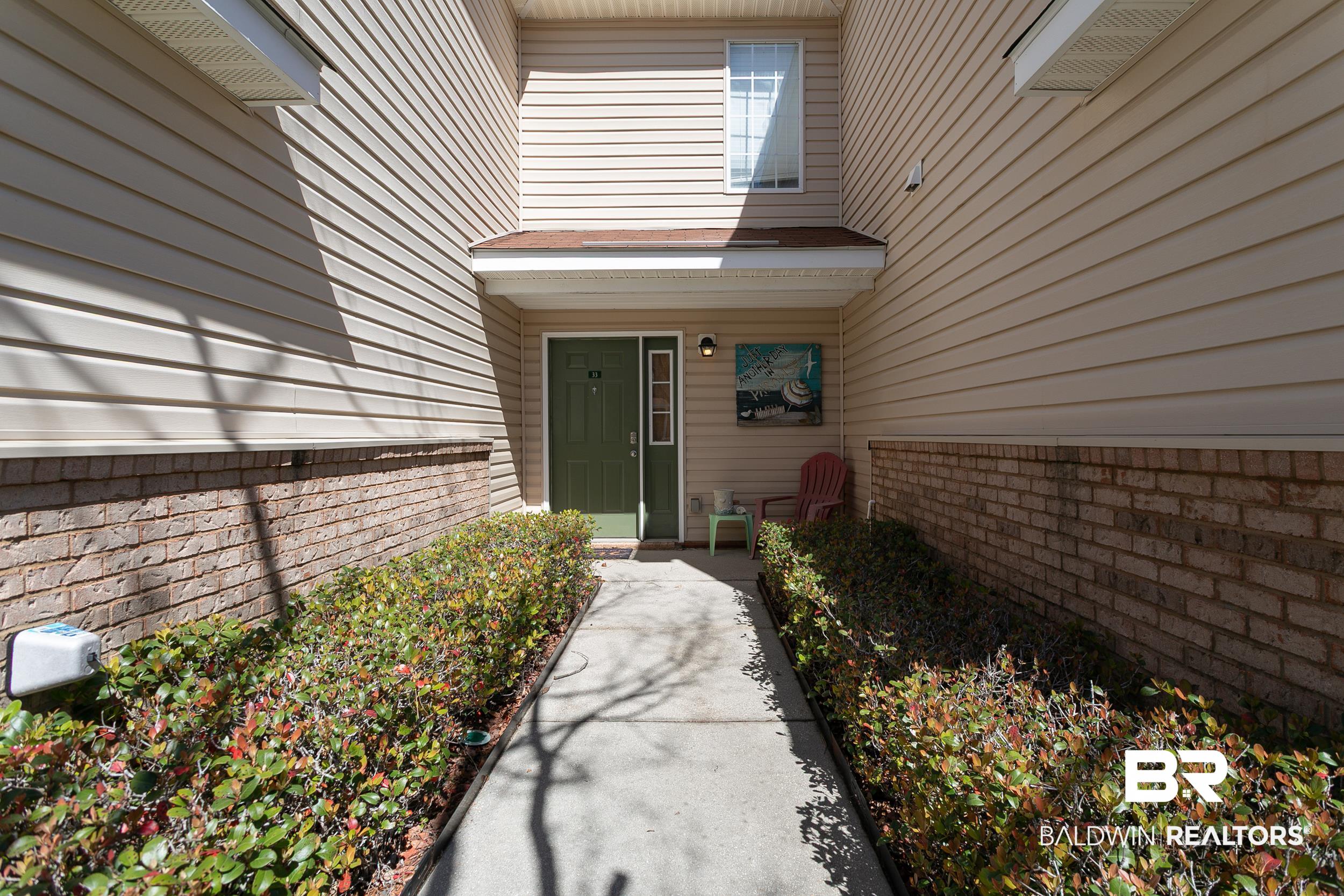 1517 Regency Road, Unit 33 Gulf Shores, AL 36542 - Photo 29 of 29 Property entrance featuring brick siding