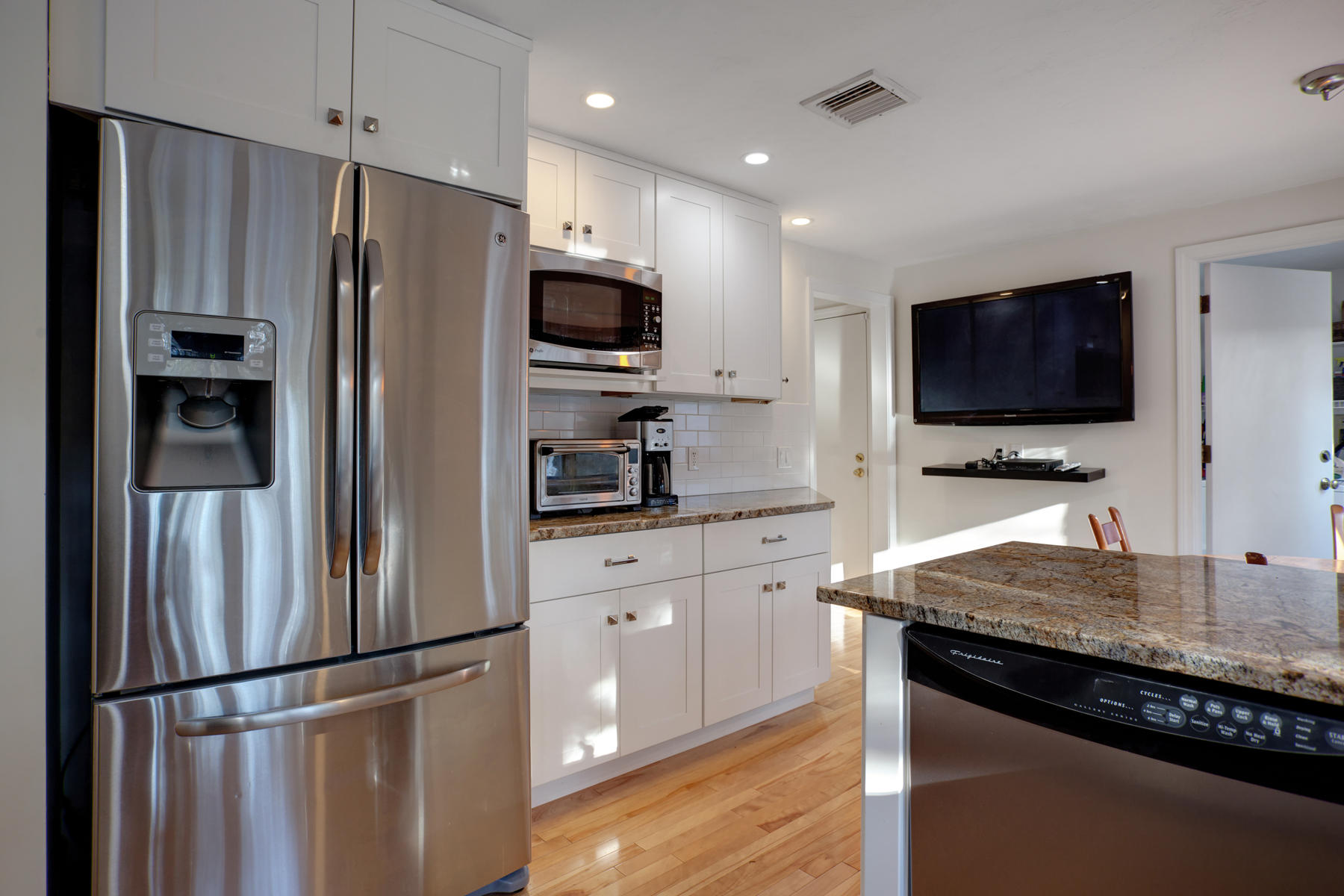 47 Meadowbrook Road Mashpee, MA 02649 - Photo 11 of 31 a kitchen with stainless steel appliances granite countertop a refrigerator stove and microwave