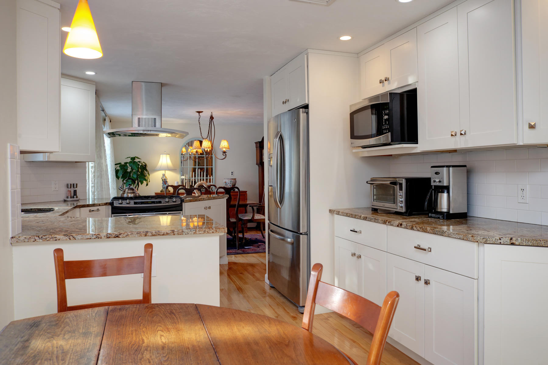 47 Meadowbrook Road Mashpee, MA 02649 - Photo 13 of 31 a kitchen with stainless steel appliances kitchen island granite countertop a refrigerator stove microwave and sink