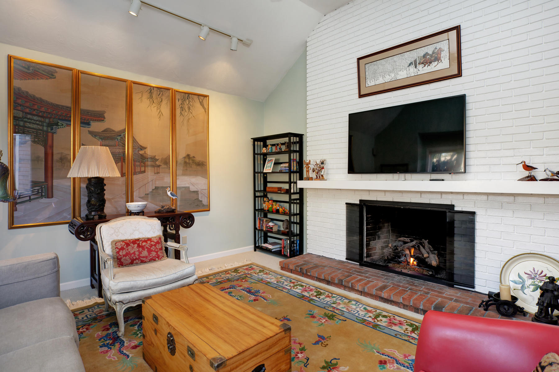 47 Meadowbrook Road Mashpee, MA 02649 - Photo 6 of 31 a living room with a fireplace furniture and a flat screen tv