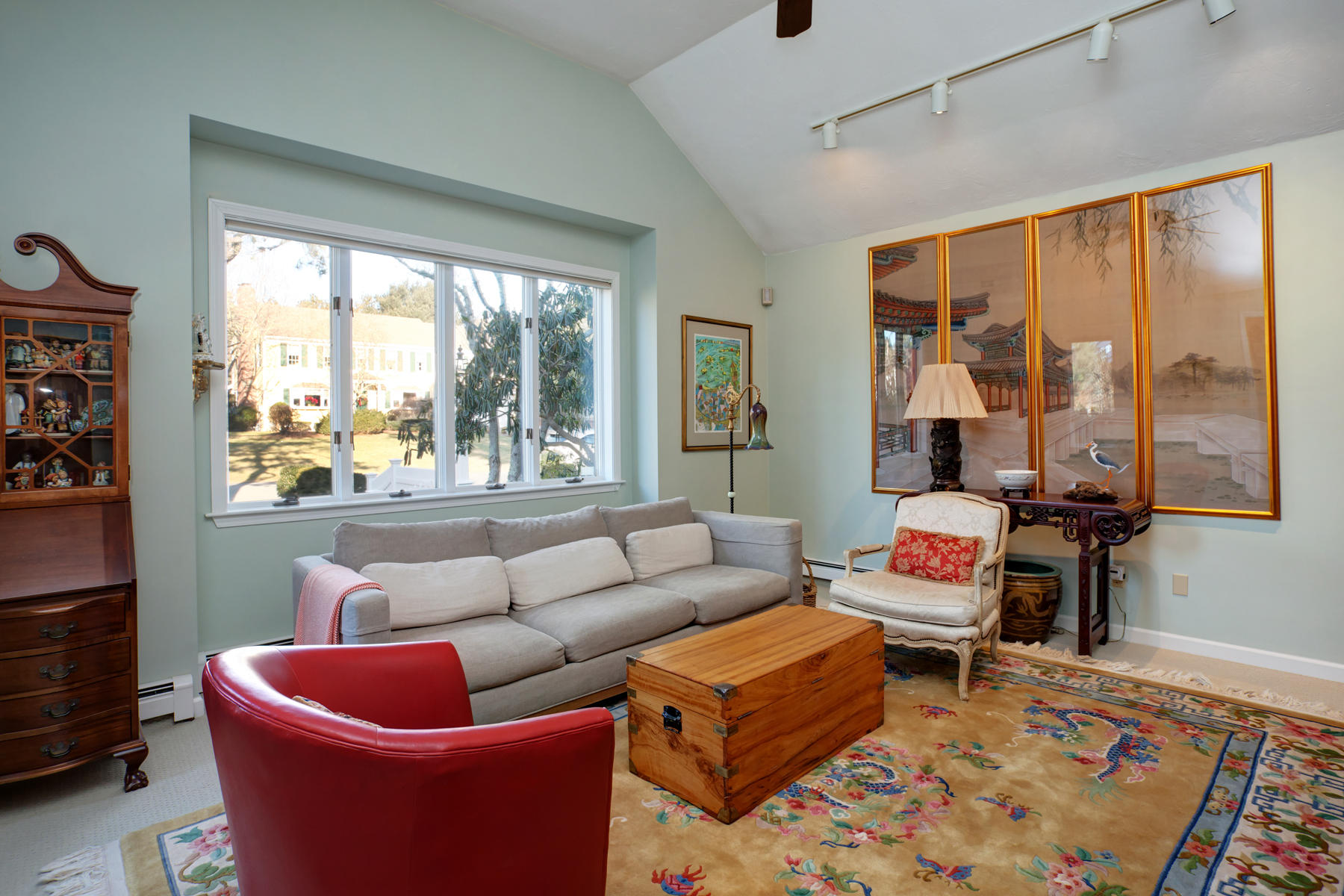 47 Meadowbrook Road Mashpee, MA 02649 - Photo 7 of 31 a living room with furniture and a floor to ceiling window