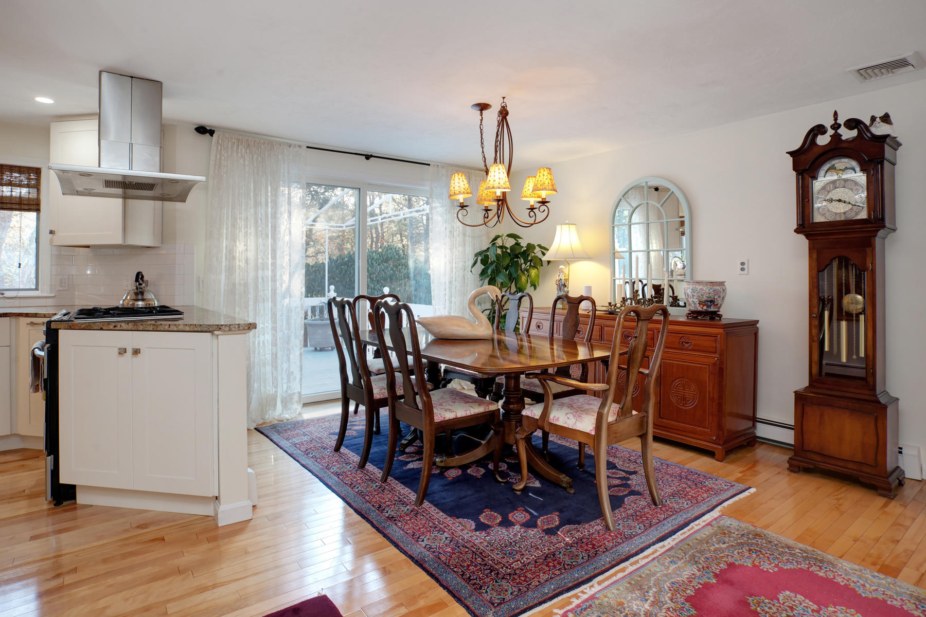 47 Meadowbrook Road Mashpee, MA 02649 - Photo 9 of 31 a view of a dining room with furniture a chandelier and wooden floor
